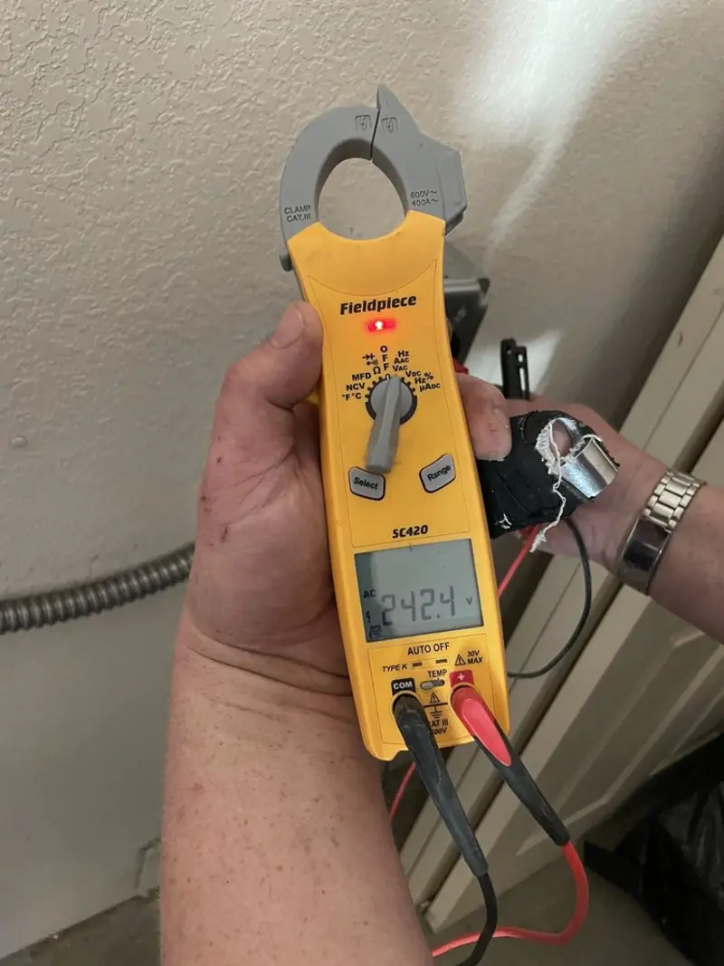 Voltage testing with clamp meter during Electrical Installation Services in Marlow